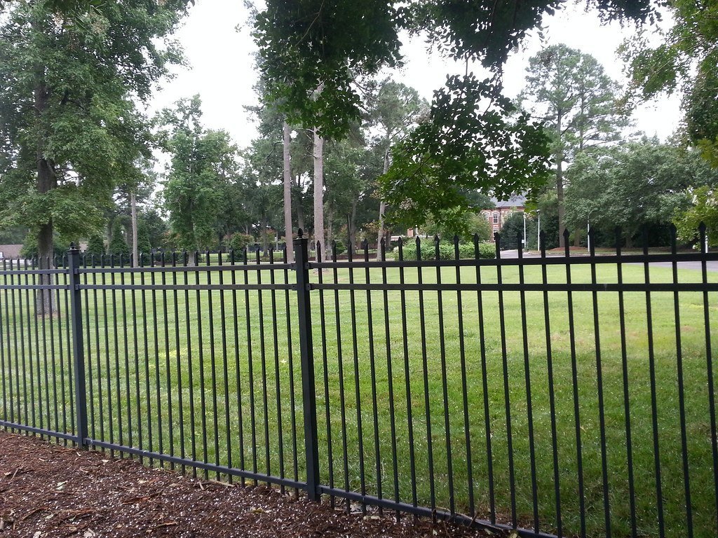 3. Wrought Iron Fence: Timeless Elegance With Real Authority (Wild Growth Digital, Flickr, CC BY 2.0)