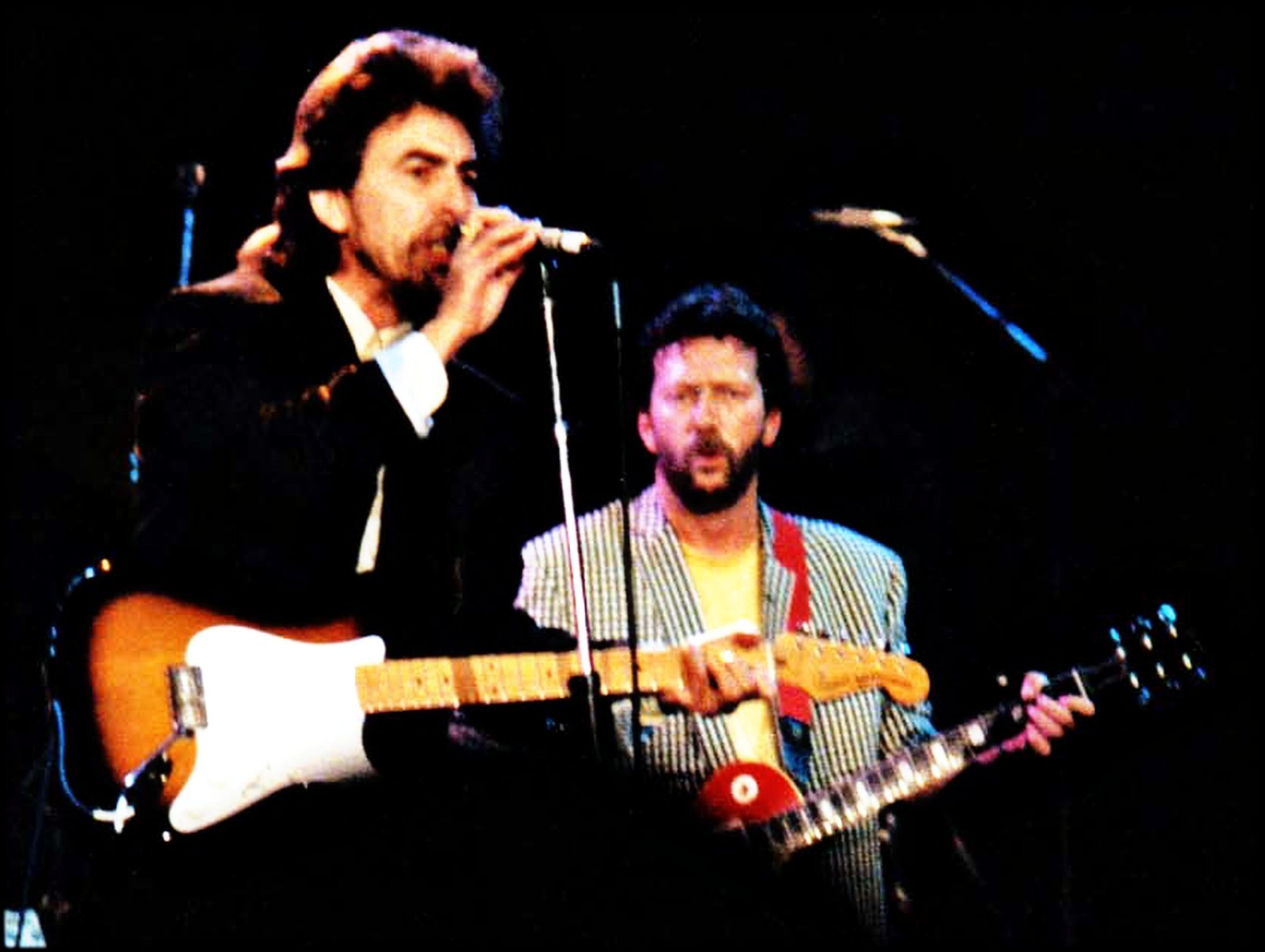 Fact 3: George Harrison Assembled a 24-Piece Supergroup in Weeks (By Harrison and Clapton.jpg: Steve Mathieson
derived work: Clusternote, CC BY-SA 3.0)