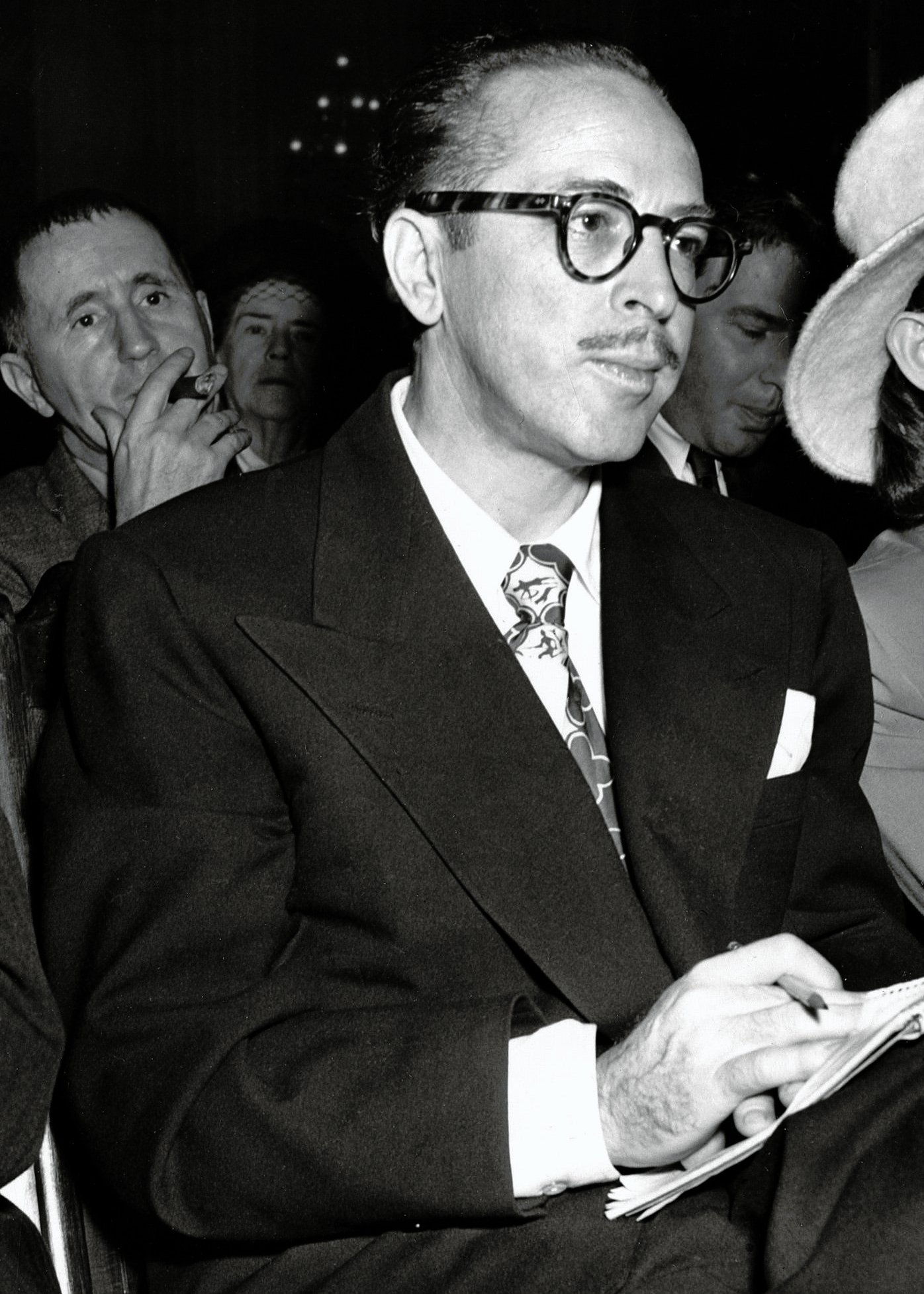 Political Shadows: The Blacklist and McCarthyism (By Trumbo_and_Cleo_1947_HUAC_hearings.png: Unknown
derivative work: Pessimist2006 (talk), Public domain)