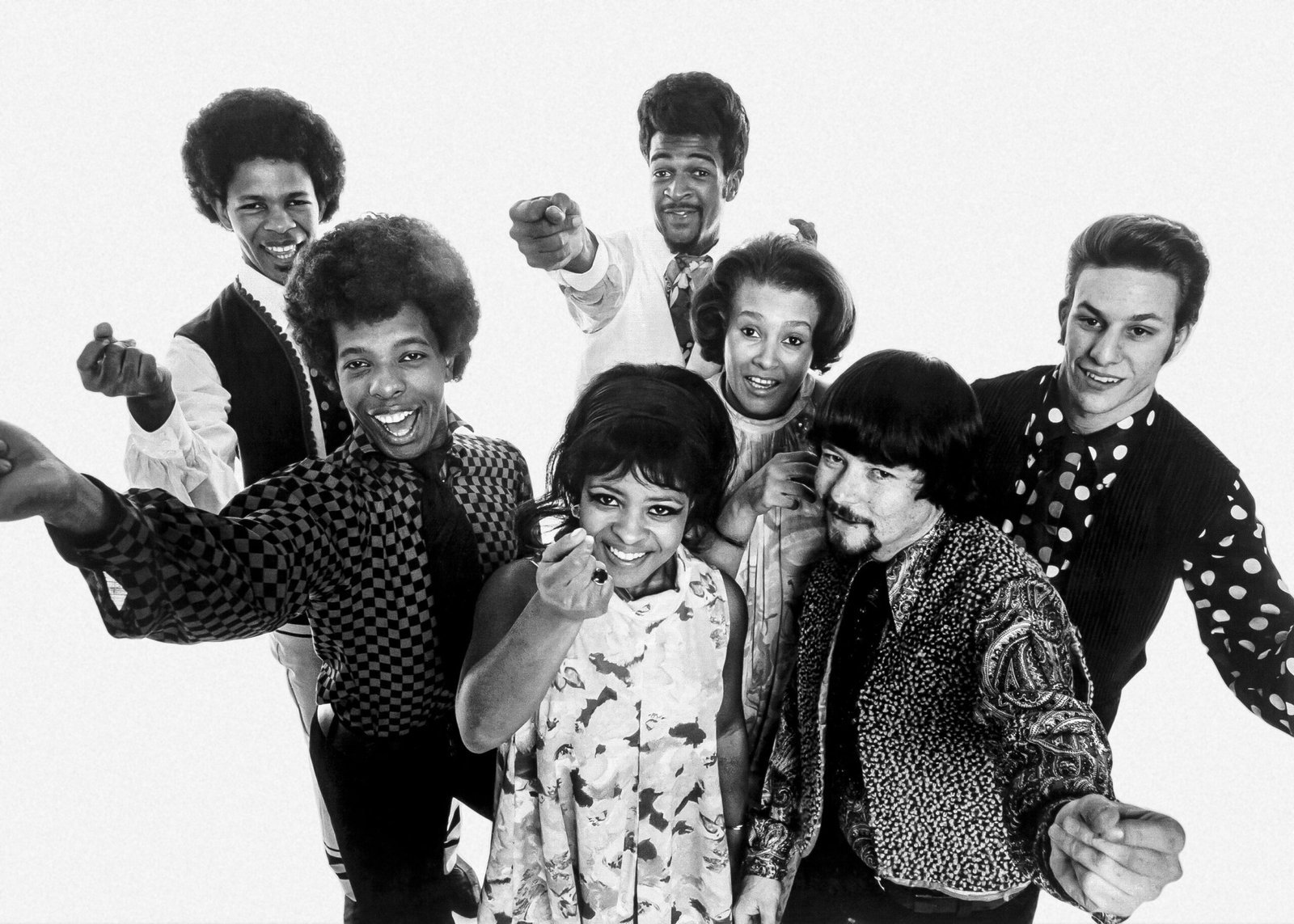 Sly & Family Stone Energize Rainy Woodstock (The photo was first published as a publicity photo.
Original source: A scan of a signed copy of the original publicity photo can be seen at Heritage Auctions and in the upload history below to verify the lack of valid copyright notice as originally published.
Instant source: High-res, cropped scan via RollingStone.com (retrieved March 20, 2021). Cropped and retouched by uploader; see unretouched original in upload history below., Public domain)