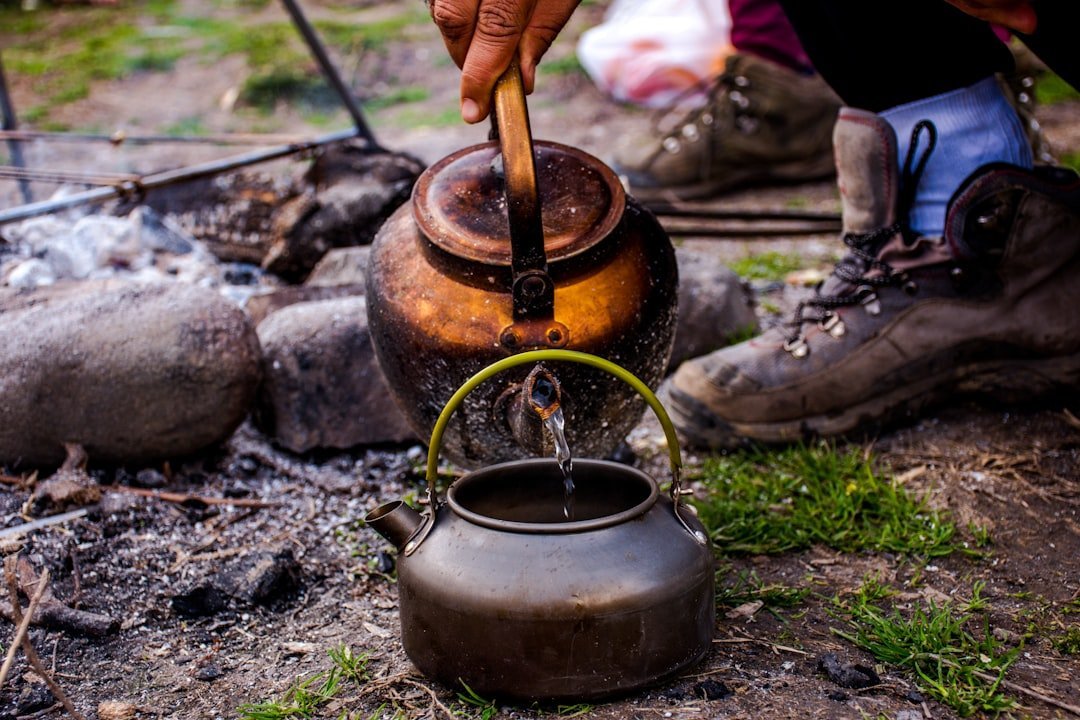 7. Pouring Boiling Water on Weeds (Image Credits: Unsplash)
